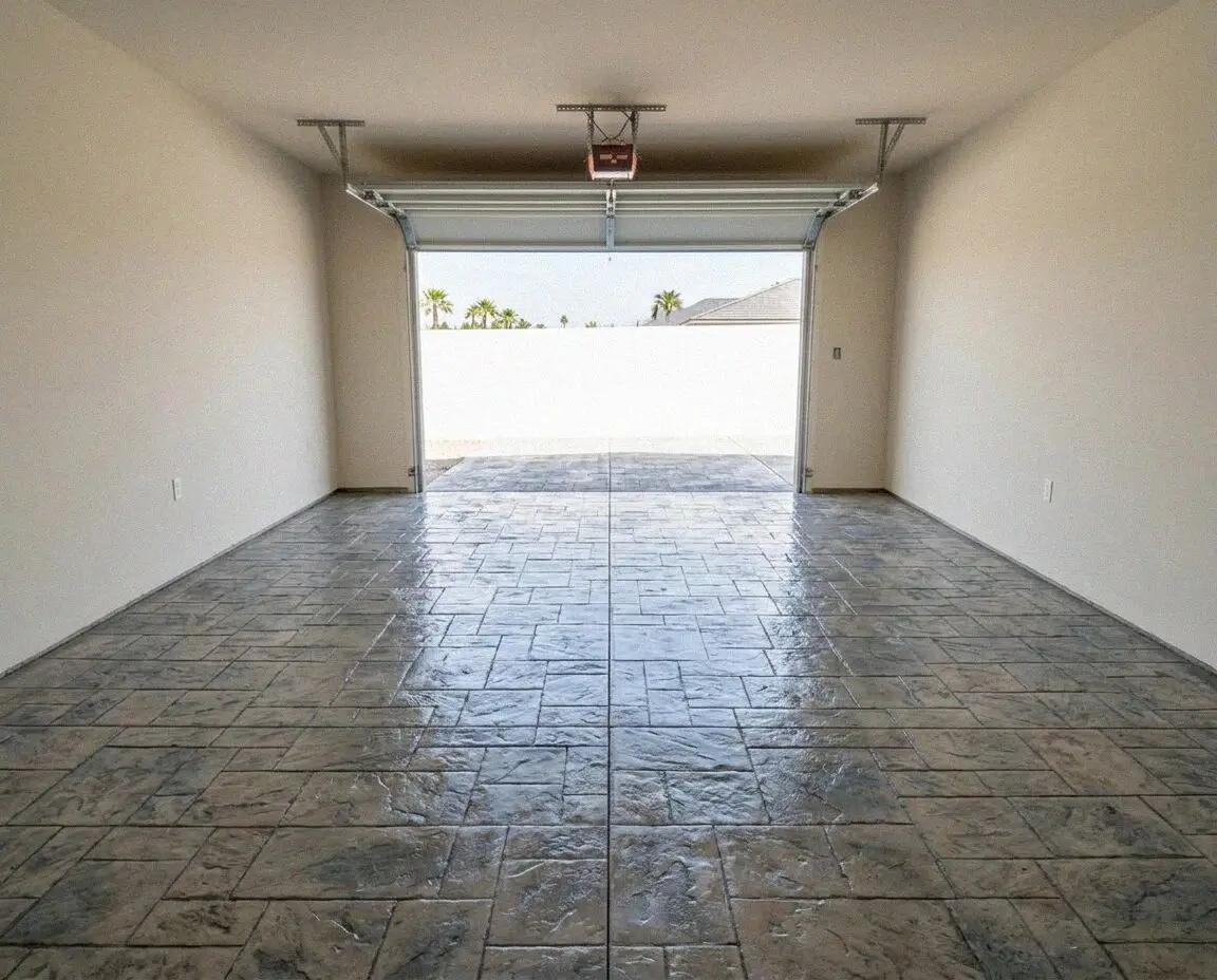 A freshly screeded concrete garage floor slab in an Irvine garage